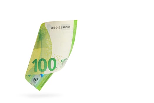 One hundred euro banknote isolated on white background. European money folded in half, close-up of money casts a shadow