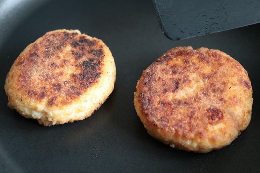 Cheesecakes are fried in a frying pan. Light and delicious food