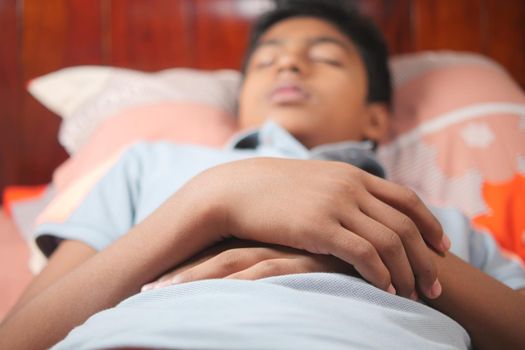 teenage boy boy sleeping in bed, selective focus