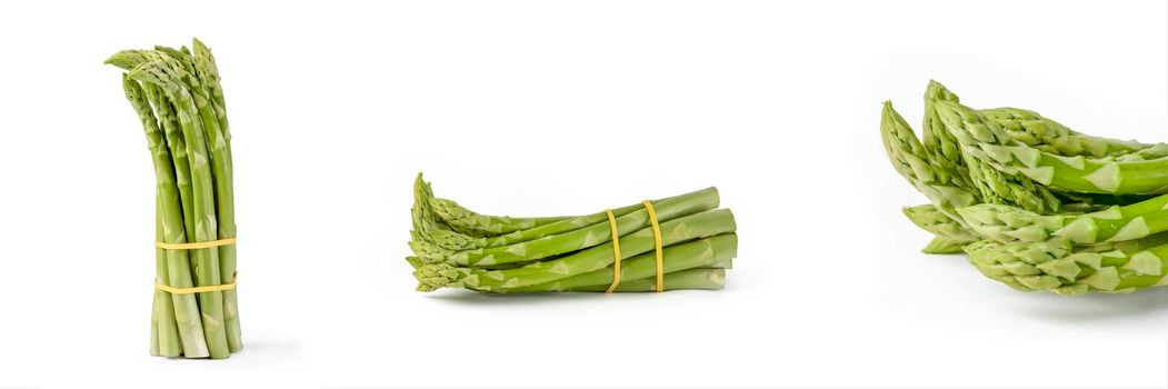 Bunch of fresh green asparagus isolated on white background. Big set freshly picked asparagus with water drops isolated on white background