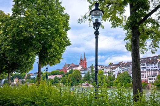 Rhine river green waterfront and Basel Minster view, northwestern Switzerland