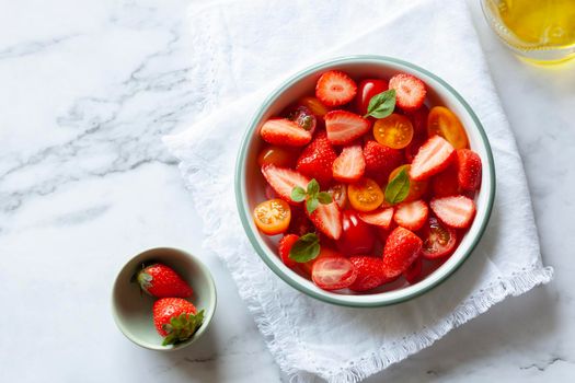 portion of tomato cherry and strawberry salad, top view