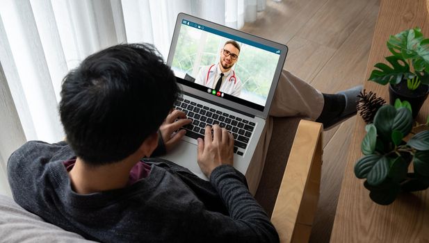 Doctor video call online by modish telemedicine software application for virtual meeting with patient