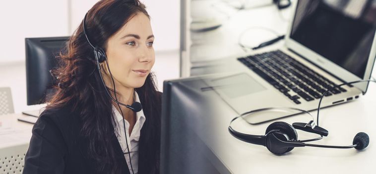 Business people wearing headset working in office to support remote customer or colleague. Call center, telemarketing, customer support agent provide service in broaden view .