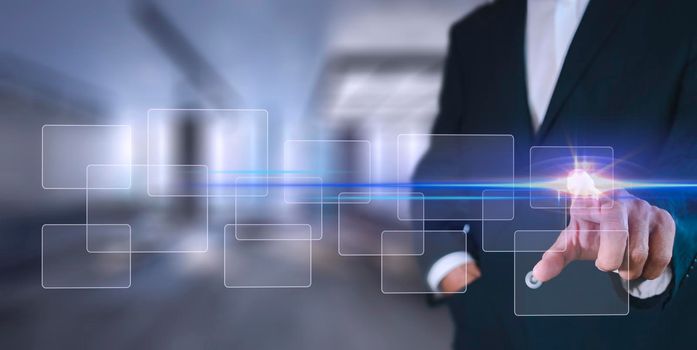 Businessman pressing button on hologram virtual screens with hexagons and transparent. Business technology internet and virtual reality concept.