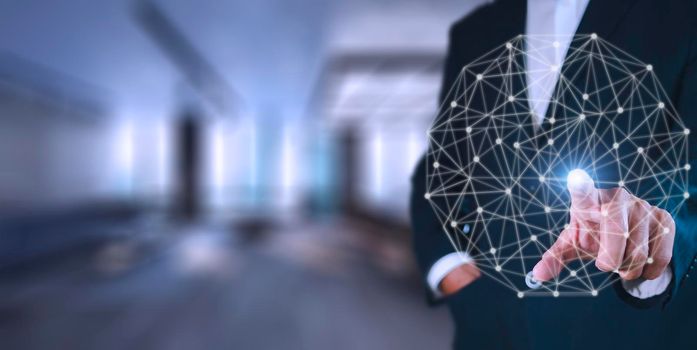 Businessman pressing button on hologram virtual screens with hexagons and transparent. Business technology internet and virtual reality concept. With copy space