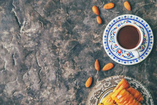 A cup of Turkish coffee and baklava. Selective focus. drink.