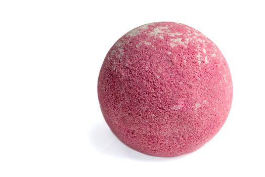 Aromatic bomb for the bathroom on a white background. aromatic bath ball of red color