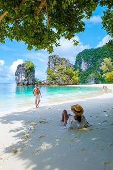 Koh Hong Island Krabi Thailand, a couple of men and women on the beach of Koh Hong, a tropical white beach with Asian women and European men in Krabi Thailand