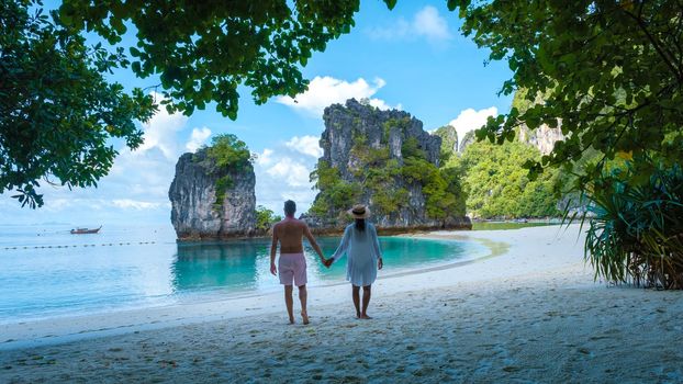 Koh Hong Island Krabi Thailand, a couple of men and women on the beach of Koh Hong, a tropical white beach with Asian women and European men in Krabi Thailand