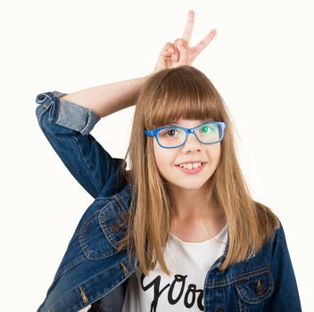 teen girl in glasses and denim jacket on a light background