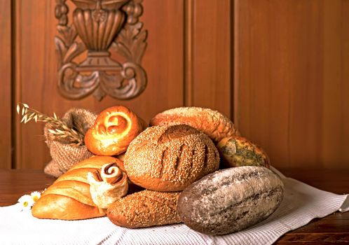 fresh bread and wheat on the wooden