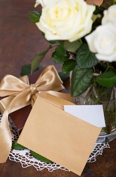 Beautiful white flowers. Roses with envelope and hearts. Empty space for your ad or inscriptions or messages.