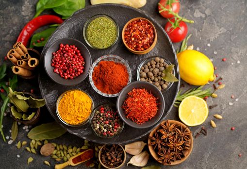 Assortment of natural spices on dark rustic stone background, Healthy spice concept