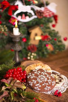 Christmas decoration with cookies and spices on an old wooden background.