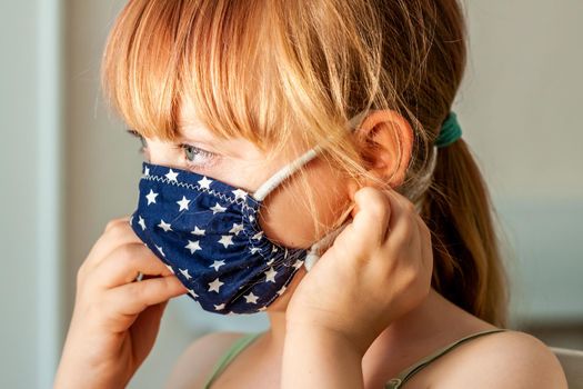 Close up of girl wearing a mask during the pandemic.