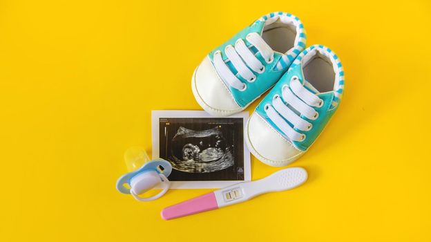 Ultrasound picture of a baby's photograph and accessories. Selective focus. child.