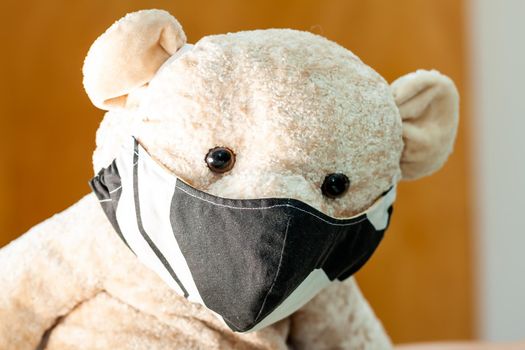 Cute Teddy bear wearing a mask - Focus on the mask.