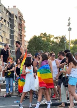 Valencia, Spain 25 June 2022: Manifest of a attractive participants of the World Pride festival in Valencia 2022. Parade of a International People celebrates the LGBT Gay Pride Parade