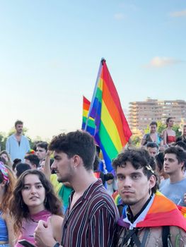 Valencia, Spain 25 June 2022: Manifest of a attractive participants of the World Pride festival in Valencia 2022. Parade of a International People celebrates the LGBT Gay Pride Parade