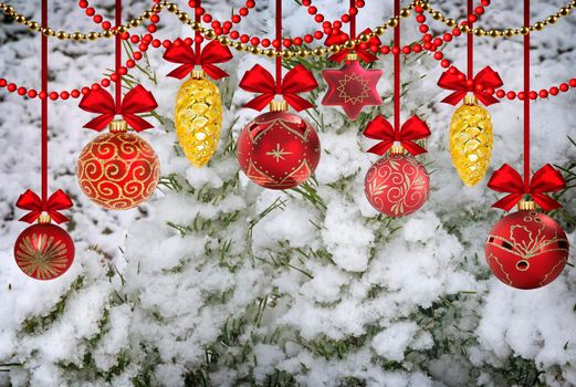 New year and Christmas card with the image of snow-covered fir trees and Christmas decorations