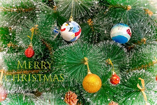 Christmas and New Year greeting card with a picture of a decorated Christmas tree and a greeting inscription.
