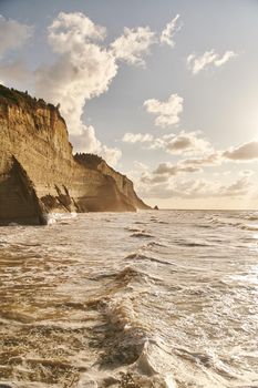 View of Logas Beach and the amazing rocky cliff in Peroulades. Corfu island. Greece.