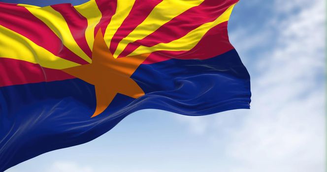 The state flag of Arizona waving in the wind on a clear day. Democracy and independence. American state.