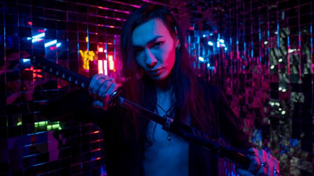 Male transgender neon light studio. Asian with samurai sword