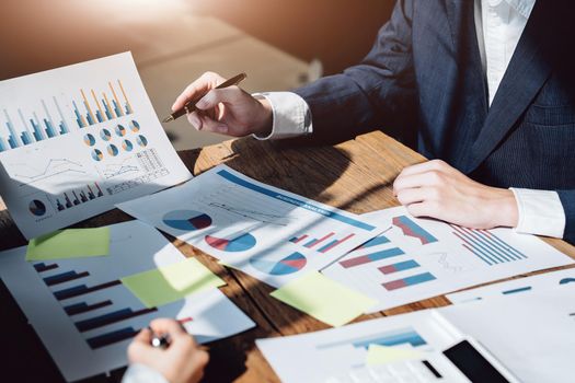 Planning to reduce investment risks, the image of a group of businesspeople working with partners is adjusting marketing strategies to analyze profitable and targeted customer needs at meetings.