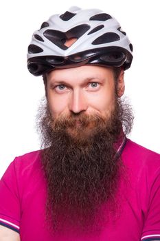 funny happy european bearded cyclist wearing helmet with pink or purple t shirt. advise people to protection. studio shot. isolated on white.