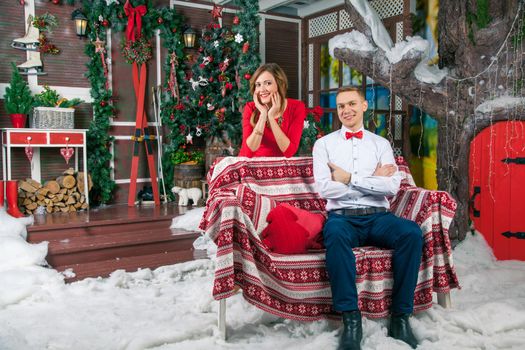 Young beautiful love couple celebrating new year. Woman and man celebrating Christmas