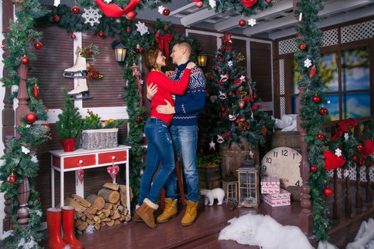 Young beautiful love couple celebrating new year. Woman and man celebrating Christmas