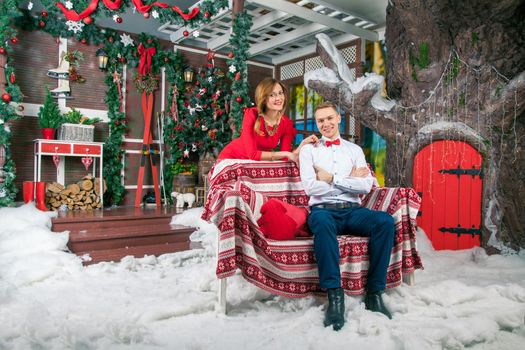 Young beautiful love couple celebrating new year. Woman and man celebrating Christmas