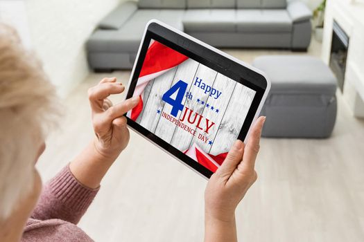 United states flag on white, weathered clapboard background with july 4th greeting. High quality photo