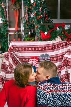 Young beautiful love couple celebrating new year. Woman and man celebrating Christmas