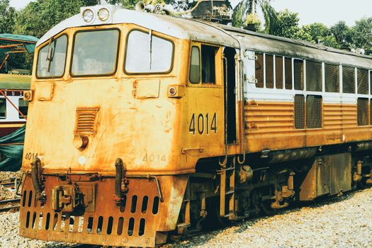 Yellow train, Thailand train. Procession yellow Train led by diesel electric locomotive on the tracks from Thailand