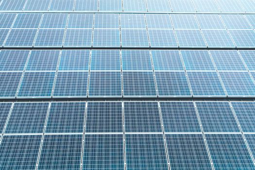 Aerial top view of a solar panels power plant. Renewable energy concept . Detailed close-up of modern large photovoltaic solar panels