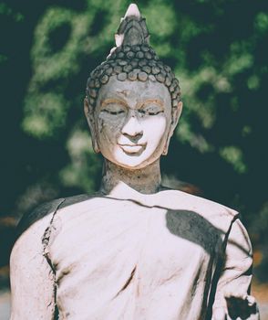 Statue of Buddha standing in meditation.Close up statue Buddha.buddhism concept .peacefulness idea .lifestyle practise mind in clamness