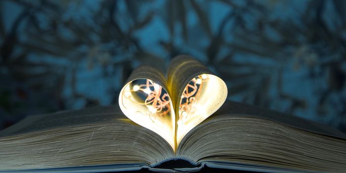 Book with love symbol , Love books, love to read, love stories, heart shape from paper book, Romantic background with the book with light inside