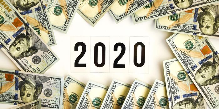 Budget 2020, the inscription on white space, on the background of dollar bills. New year budget concept. Business, planning businness