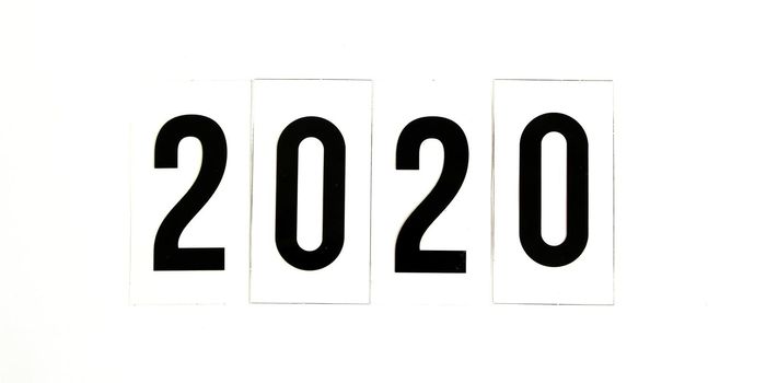 2020 word in wood box on a white background concept happy new year, copy space for text