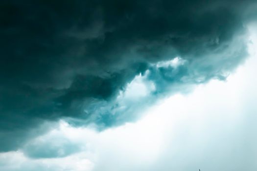 Dark sky and black clouds before rainy, Dramatic black cloud and thunderstorm .half of sky .season change