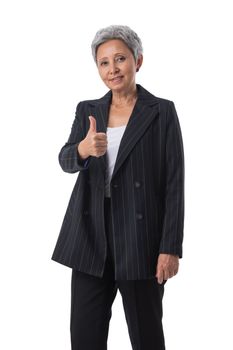 Portrait of confident mature asian businesswoman showing thumb up isolated on white background