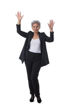 Mature asian business woman winner with raised arms isolated on white background full length studio portrait