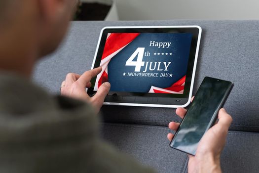 man searching website with information of the celebration of Independence Day hands of a man looking in web a site with information of 4th July. High quality photo