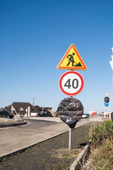 Road marking on the road, warning signs. International traffic signs Road construction and Speed Limit