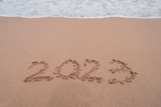 New year 2023 is coming with sunset beach background. New start for planing or set new resolution in life .Business solution. 