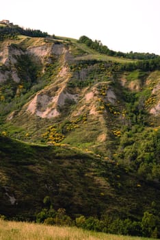 Eroded hills in Montespino, near Pesaro and Urbino in Italy, at evening before the sunset