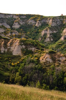 Eroded hills in Montespino, near Pesaro and Urbino in Italy, at evening before the sunset